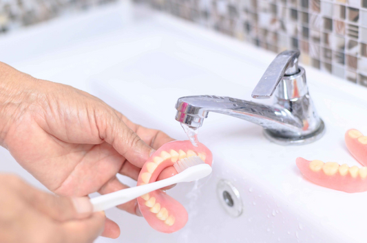  How to remove polident from gums.